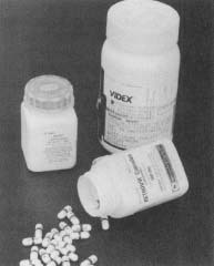 Three of the drugs commonly used to treat AIDS are DDC (left), DDI (right), and AZT (front).