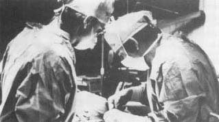 Doctors prepare a patient for cryogenic surgery.