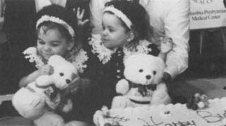Siamese twins Carmen and Rosa Taveras celebrate their first birtay. The girls were successfully separated during an operation in 1993.